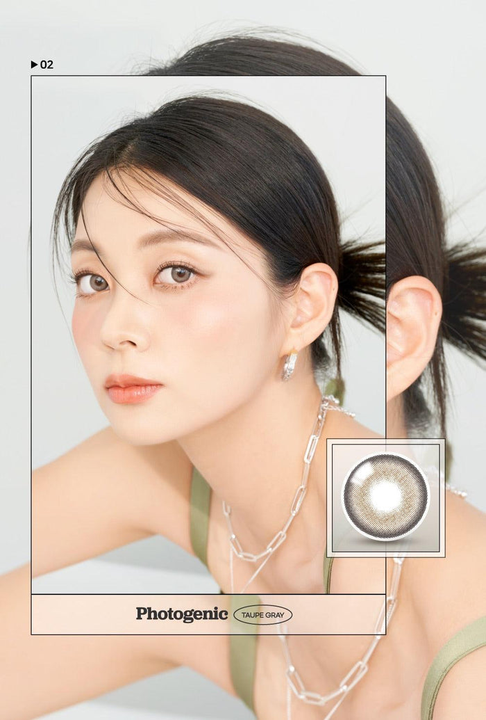A close-up of a model demonstrating a natural makeup look with Ann365 Photogenic 1-Day Taupe Grey (10pk) circle colour contacts, highlighting how well the contact lenses blend with her dark eyes.