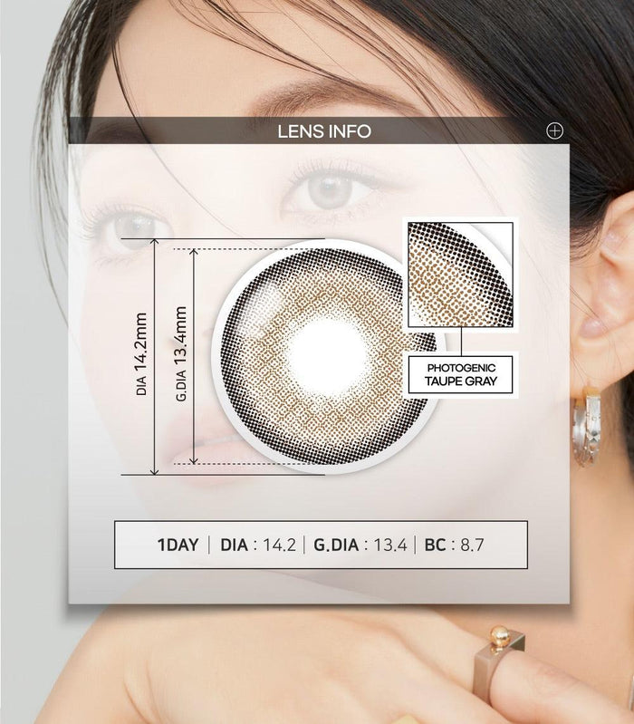 A close-up of a model demonstrating a natural makeup look with Ann365 Photogenic 1-Day Taupe Grey (10pk) circle colour contacts, highlighting how well the contact lenses blend with her dark eyes.