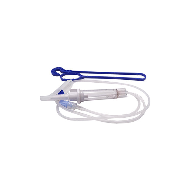 A medical infusion set, consisting of a translucent tube and a chamber, lies coiled on a white background alongside a blue plastic clip.