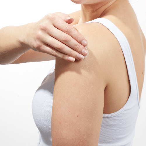 GIF of model applying Beekman 1802's Pure Whipped Body Crean down her left arm while facing away from the camera.