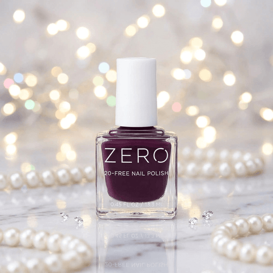 Bottle of ZERO nail polish with a blurred background of lights and pearls