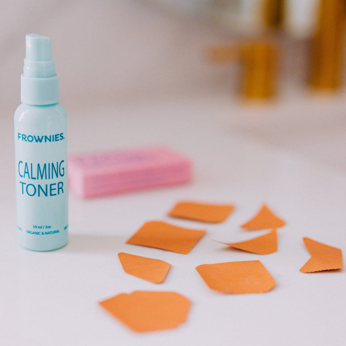 Frownies calming toner pictured along with Frownies facial patches aid out
