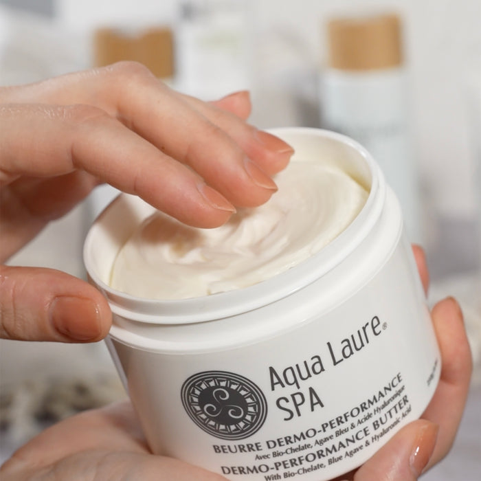 Hand dipping into Aqua Laure SPA Dermo-Performance Butter with Bio-Chelate & Hyaluronic Acid for luxurious skin hydration