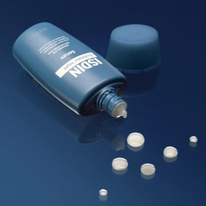 ISDIN Eryfotona Night blue tube serum with cap and cream droplets