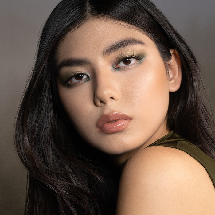Mini Gloom Palette inspired model look on a dark green background.