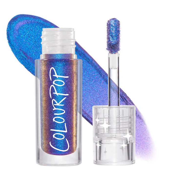 Morpho Chrome Liquid Shadow by ColourPop stands open, doe-foot applicator coated in blue‑purple, copper-shifting multichrome, clear tube with ColourPop logo and star-detailed cap, bold swatch streak behind; ColourPop Chrome Liquid Shadow.