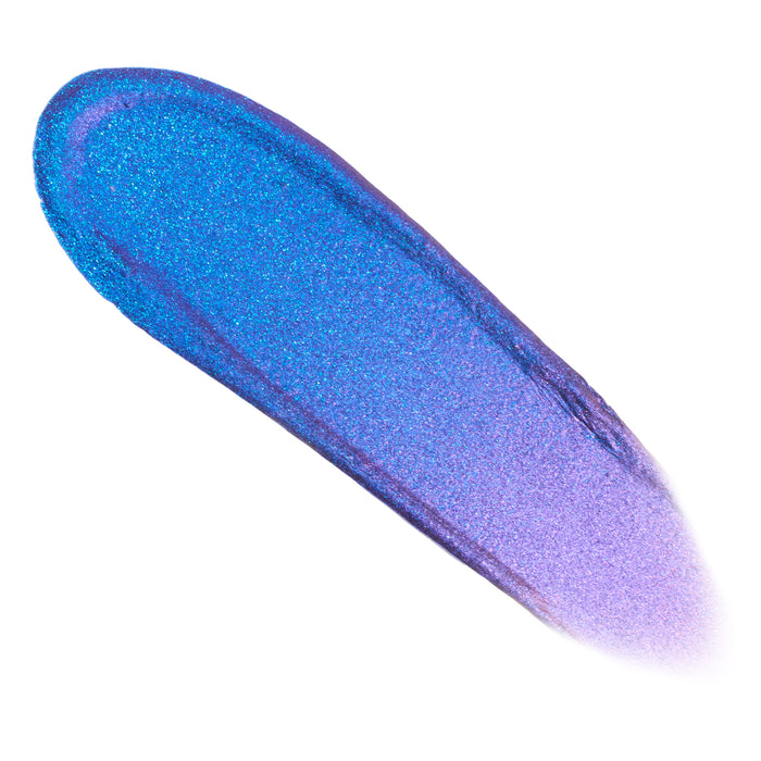Swatch streak of Morpho Chrome Liquid Shadow shifting from electric teal-blue to violet-lilac with fine sparkle, showcasing the duo-chrome payoff of the ColourPop Chrome Liquid Shadow, applied in a single swipe on a white background.