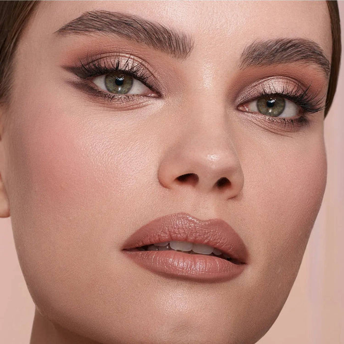 My Mini Dream Eyeshadow Palette model look on a light pink background.
