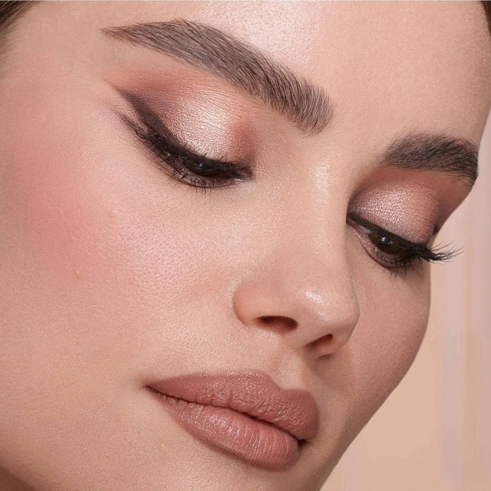 My Mini Dream Eyeshadow Palette model look on a light pink background.