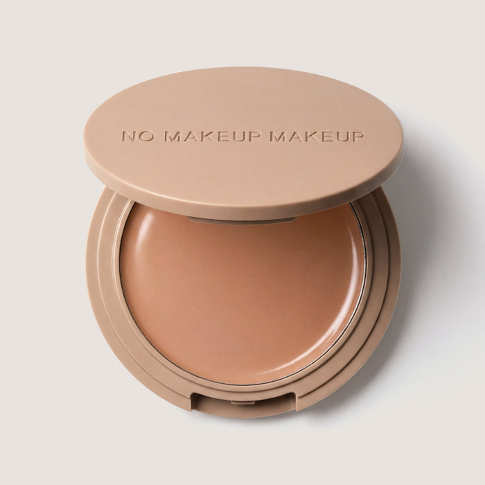 An open FlexShade Foundation by No Makeup Makeup compact in Almond with the Oprah Daily Beauty O-Wards 2024 seal