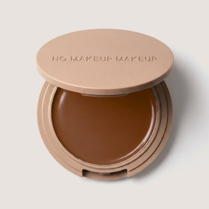 An open FlexShade Foundation by No Makeup Makeup compact in Dark with the Oprah Daily Beauty O-Wards 2024 seal