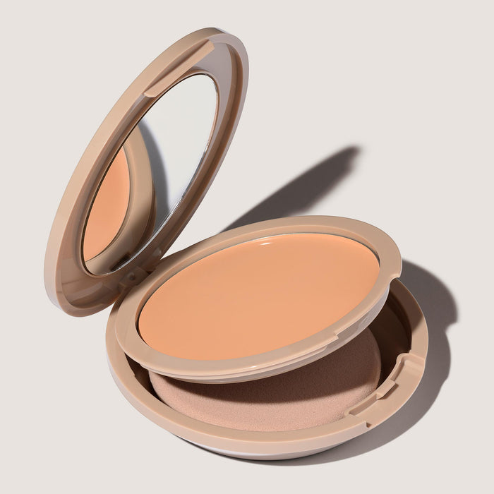An open FlexShade Foundation by No Makeup Makeup compact in Light showing the sponge compartment