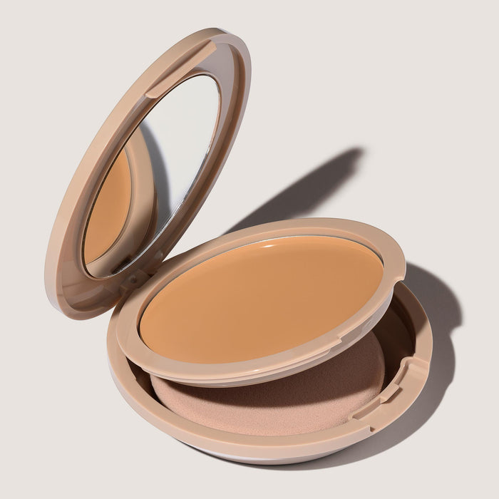 An open FlexShade Foundation by No Makeup Makeup compact in Natural showing the sponge compartment