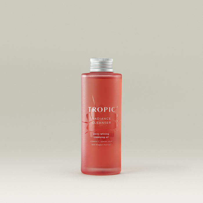 Tropic Radiance Cleanser pore-refining cleansing oil refill. Contains Vitamin C, azelaic acid and dragon fruit oil.

Aluminium screw cap. Pink glass bottle with floral embossed design behind white text.