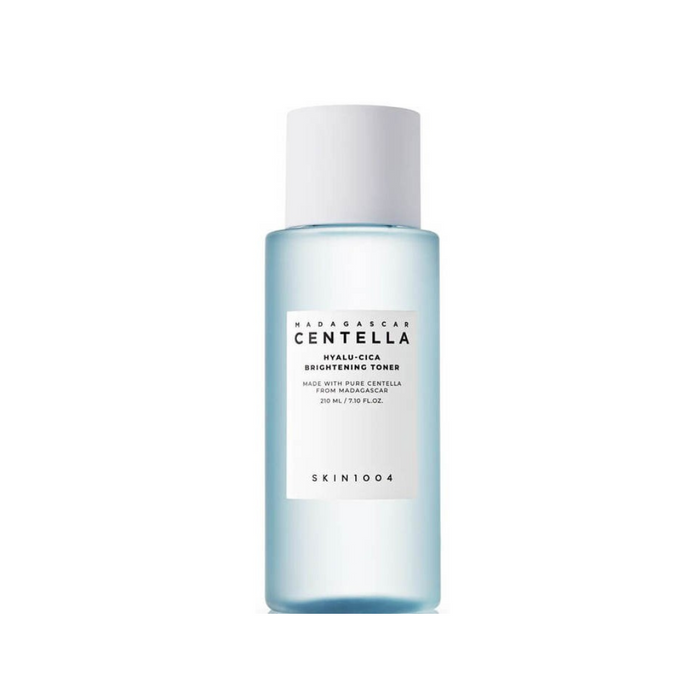 SKIN1004 Madagascar Centella Hyalu-Cica Brightening Toner is a refreshing toner formulated with 74% Centella Asiatica leaf water to soothe and calm sensitive skin. This lightweight toner is enriched with Niacinamide for brightening, Hyaluronic Acid for deep hydration, and LHA (Capryloyl Salicylic Acid) for gentle exfoliation. A blend of plant extracts like Hibiscus Esculentus and Rosa Damascena flower water nourishes and revitalizes your complexion. Perfect for all skin types, especially those l