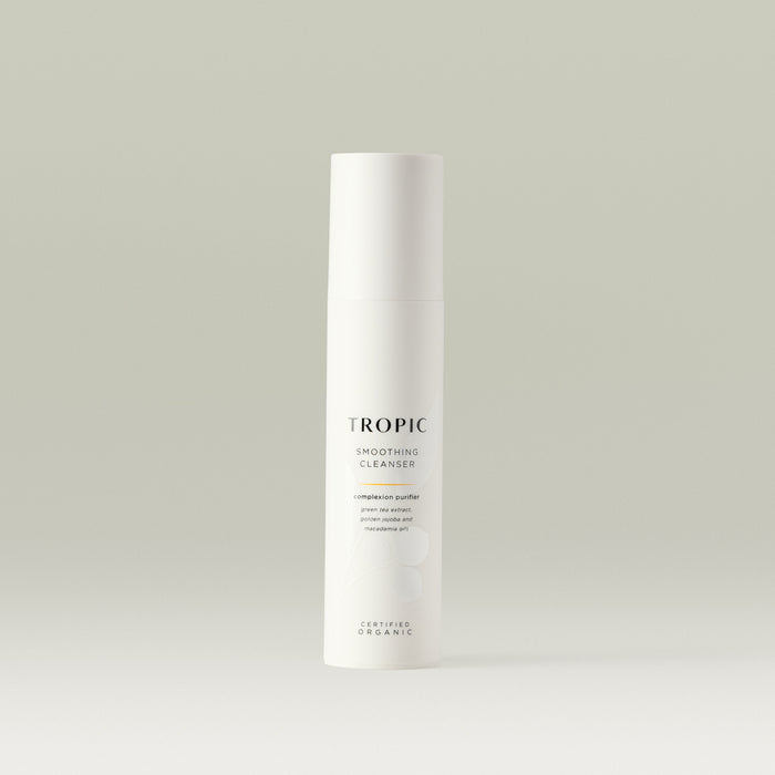 Tropic Smoothing Cleanser complexion purifier 120ml.
Contains green tea extract, golden jojoba and macadamia oils. Certified Organic. White tube with white lid. Leaf design features behind black text.