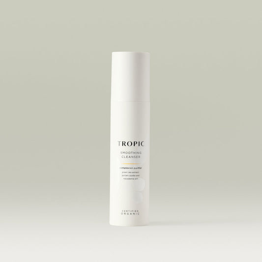 Tropic Smoothing Cleanser complexion purifier 120ml.
Contains green tea extract, golden jojoba and macadamia oils. Certified Organic. White tube with white lid. Leaf design features behind black text.