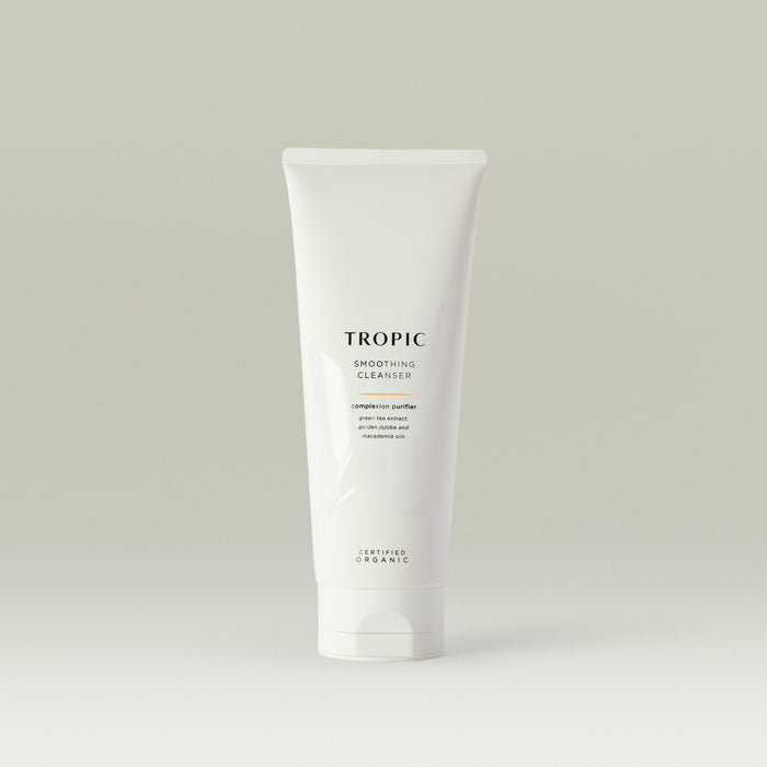 Tropic Smoothing Cleanser complexion purifier 240ml
Contains green tea extract, golden jojoba and macadamia oils. Certified Organic. White squeeze tube with white lid. Leaf design features behind black text.
