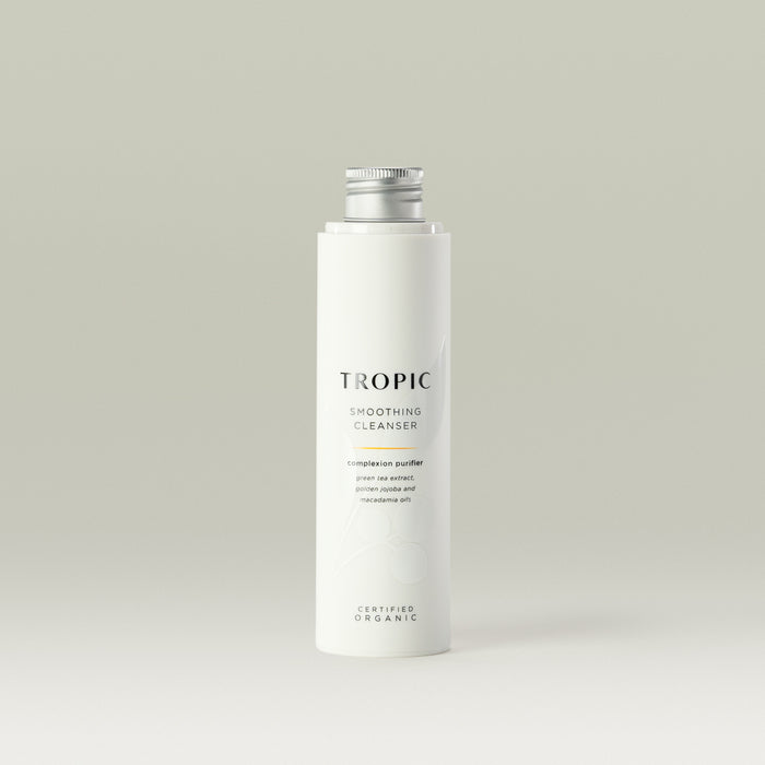 Tropic Smoothing Cleanser complexion purifier 120ml Refill.
Contains green tea extract, golden jojoba and macadamia oils. Certified Organic. White tube with white lid. Leaf design features behind black text.