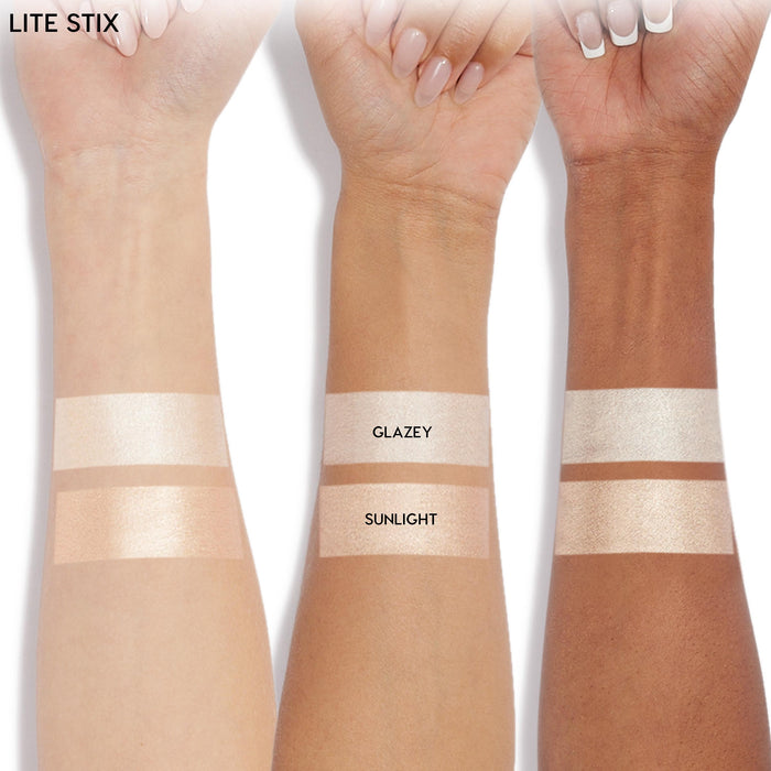 ColourPop Lite Stix highlighter in Sunlight swatched on three forearms - light, medium, and deep skin - showing a warm champagne glow; Glazey swatch sits above for comparison, labels visible in a clean studio product shot.