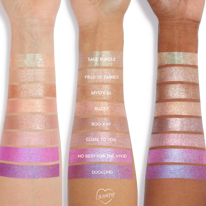 Super Cool Jelly Much Shadow eyeshadow by Colourpop swatched on three arms, showing shimmery pastel and vibrant shades from sage and champagne tones to bright pinks and purples, highlighting pigment and finish across multiple skin tones.