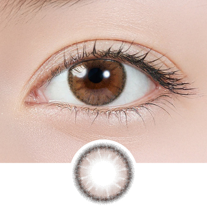 Close-up of eye wearing EyeCandys Topards 1-Day Pearl Cats Eye (10pk) prescription colored contact lens with lens design shown below, warm beige and light brown two-tone gradient with soft blurred outer edge, Korean daily disposable colored contacts for natural eye enhancement