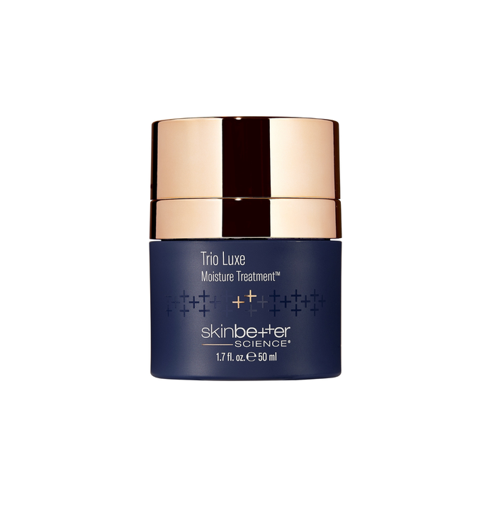 Blue skincare jar with gold lid on a white background